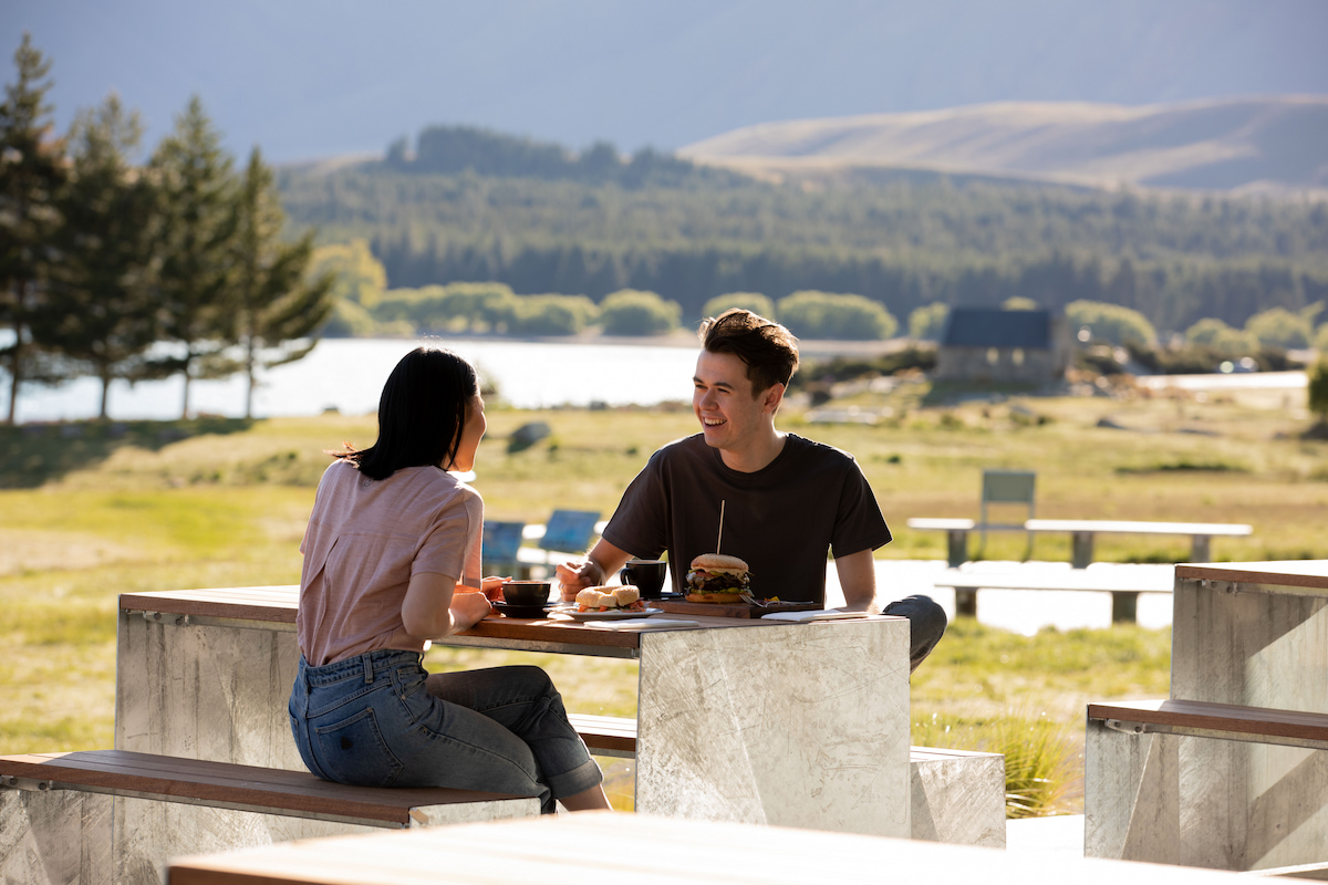 Couple sharing a meal outside at the Dark Sky Diner